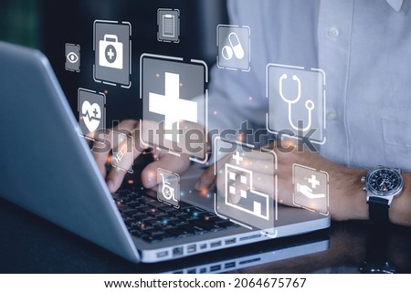 Businessman using a computer to Insurance health concept. health insurance business online and healthcare. Royalty-Free Stock Photo #2064675767