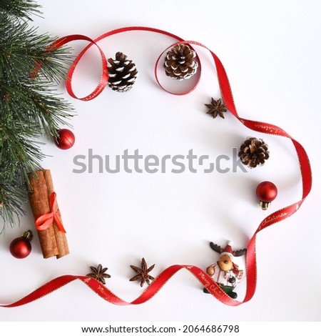 Festive Merry Christmas or New year background with pine cone , star anise, cinnamon, Christmas decoration, Christmas figurines  streamers with copy space for winter holidays stock photo