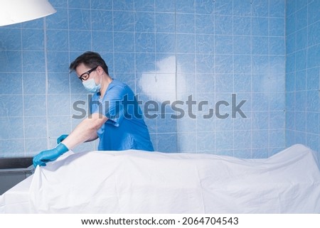 Coroner inspects the body of the crime victim (imitation)



 Royalty-Free Stock Photo #2064704543