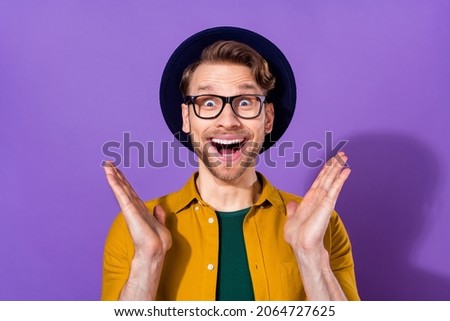 Photo of young man amazed shocked surprised omg wow happy positvie smile sale isolated over purple color background Royalty-Free Stock Photo #2064727625