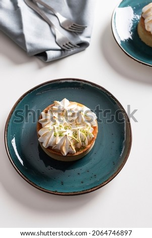 Lemon tart with meringue on a plate