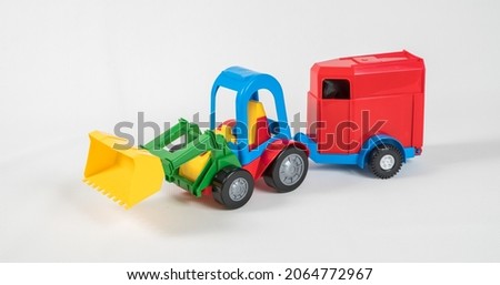 Plastic toy multicolored cars isolated on white background.