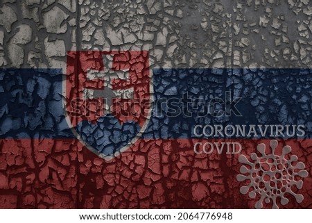 flag of slovakia on a old vintage metal rusty cracked wall with text coronavirus, covid, and virus picture.