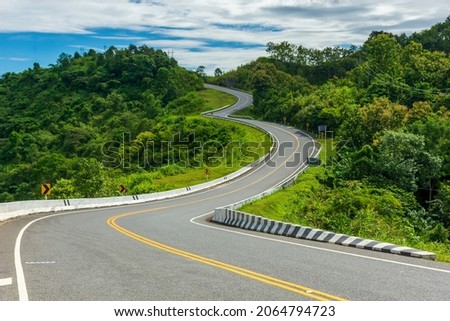New Unseen Curved road number 3 on Route Number 1081 Santisuk - Bo Kluea District, Nan province, Thailand. Is a popular place tourist come to take pictures as souvenirs Royalty-Free Stock Photo #2064794723