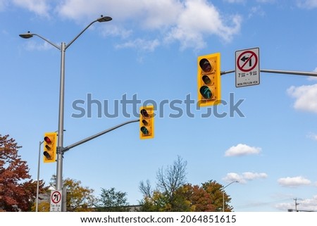 Traffic lights against blue sky on road of Ottawa city in Canada in fall season on sunny day