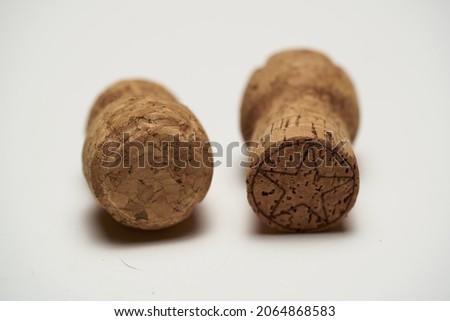 Two corks of champagne close-up on a white background. High quality photo