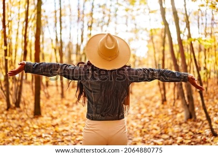 An Autumn outdoor portrait of beautiful black American young woman