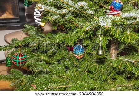 Close up view of colorful Christmas decorations on the tree. Christmas holidays concept. Sweden. 
