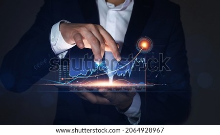 Businessman holding on tablet and draws arrow growth graph of business. Business strategy development  and growing growth plan.  Global business investment