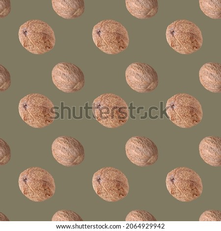 nutmeg on green background seamless pattern