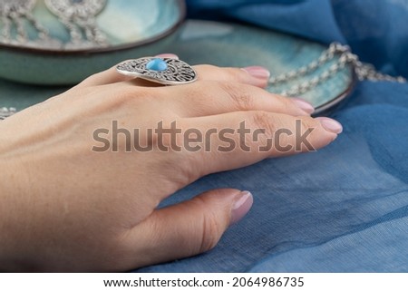 Girl wearing many antique handcrafted Turkish jewelry