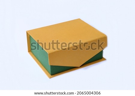 Green with yellow cover paperboard parcel box 