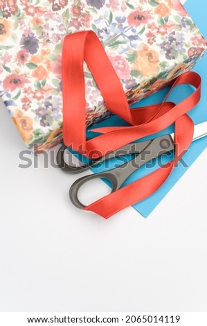 decorated box with stationery and letter paper on white background with text space