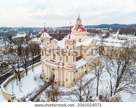 Aerial view of the Church of St. Peter and St. Paul, located in Antakalnis district in Vilnius. Beautiful winter day in the capital of Lithuania. Winter city scenery in Vilnius, Lithuania.