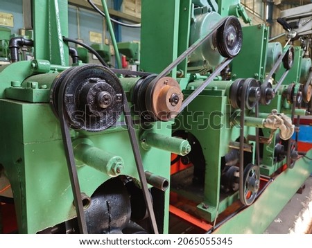 pulley and belt are transmission to another. Royalty-Free Stock Photo #2065055345