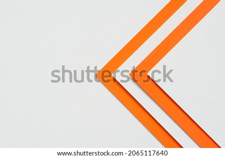 abstract background concept features orange and white paper layered on top of a blank white paper with copy space,be used as a design element or as a website cover idea.