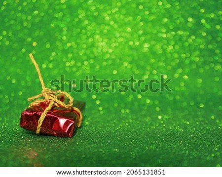 The Red Christmas Gift and The Blinked Green Background