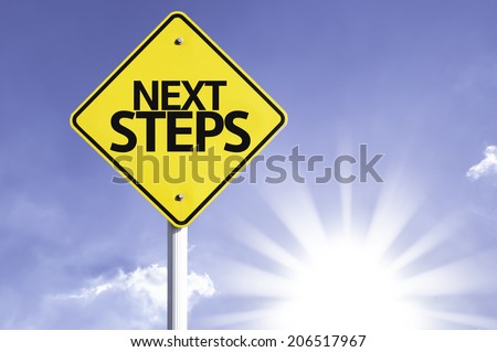 Next Steps road sign with sun background