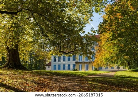 Manor house of a country estate Deciduous trees in autumn colors