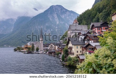 Scenic picture-postcard view of the historic Hallstatt, mountain small town in the Austrian Alps in a cloudy autumn day. UNESCO world heritage site.