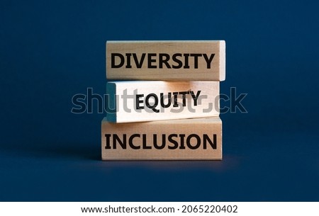 Diversity equity inclusion symbol. Concept words 'Diversity equity inclusion' on wooden blocks on beautiful grey background. Diversity, business, inclusion and equity concept. Royalty-Free Stock Photo #2065220402