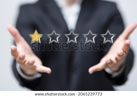 A 3D rendering of 1 out of 5 stars rating floating in between hands
