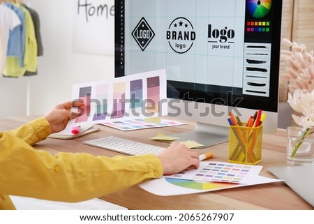 Female designer working in office Royalty-Free Stock Photo #2065267907