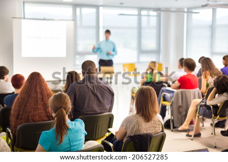 Speaker at business workshop and presentation. Audience at the conference room. Royalty-Free Stock Photo #206527285