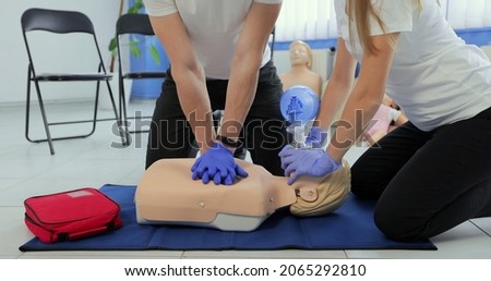 Training compression on a dummy. CPR exercise on a mannequin in the medical center. Royalty-Free Stock Photo #2065292810