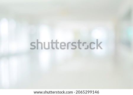 Empty corridor hallway of modern white office building room with glass entrance door business blur background, corridor in a bright room, hospital room
