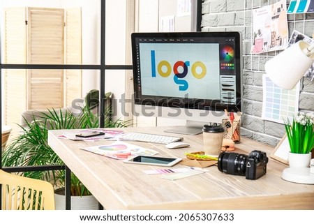 Comfortable workplace of graphic designer in office Royalty-Free Stock Photo #2065307633