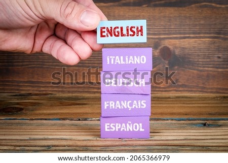 Different languages. English, Italian, German, French and Spanish. Wooden blocks.