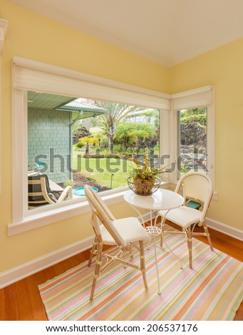 Bright and sunny breakfast table in classic home with wood floors