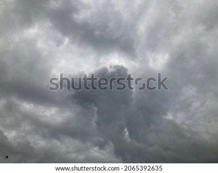 Large gray stratocumulus clouds at an altitude of less than 6,500 feet and when the weather rises, it creates a layer of clouds in the beautiful sky in Thailand. no focus