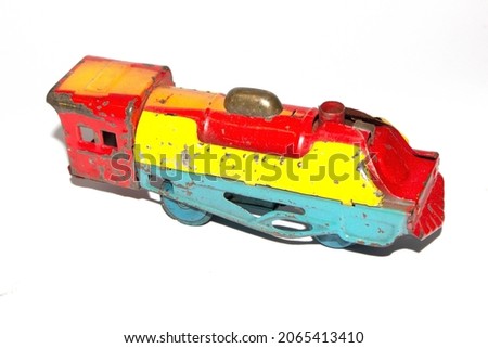 A Vintage Tin Plate Toy Train On White Background