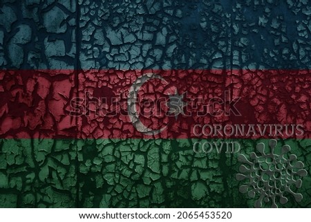 flag of azerbaijan on a old vintage metal rusty cracked wall with text coronavirus, covid, and virus picture.