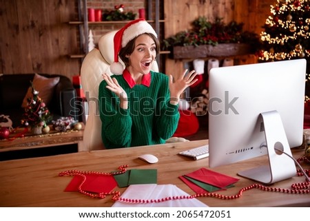 Photo of shocked funny young lady wear knitted pullover headwear looking modern device rising hands arms indoors room home house