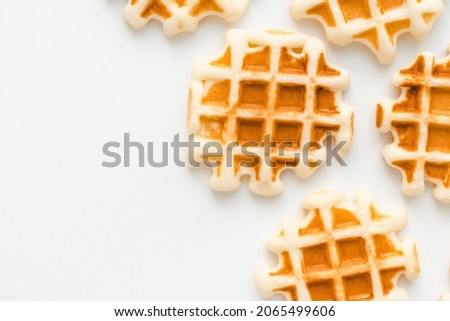 Homemade waffles. Soft waffles on a white background. 