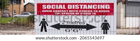 Social distancing sign shop customers to respect and stay safe