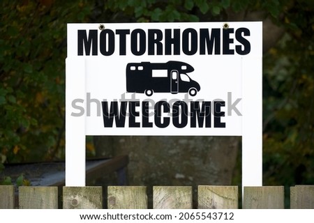 Motorhomes welcome sign at entrance to caravan park