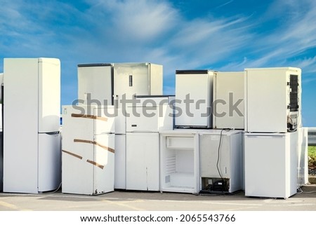 Old fridges freezers wash machines and kitchen appliances at rubbish dump Royalty-Free Stock Photo #2065543766