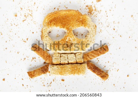 Stock image image of bread skull and crossbones with crumbs on white background