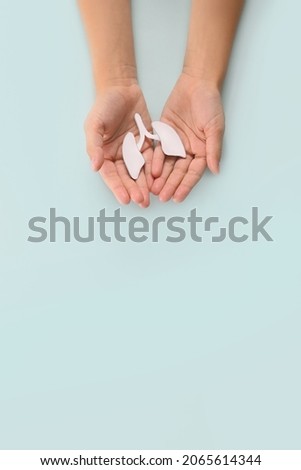 World Pneumonia Day or world tuberculosis day, copd. Child hands holding lung. Concept respiratory and chest. Pulmonary hypertension. Copy space. Vertically Royalty-Free Stock Photo #2065614344