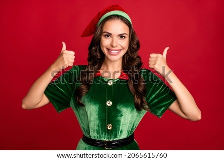 Photo portrait female elf showing thumb-up gesture smiling isolated vibrant red color background