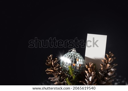 Christmas tag, black banner with disco Christmas balls mirror. bumps in the snow