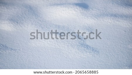 Snow background with free copy space for text. Snowy winter pattern with frozy texture.