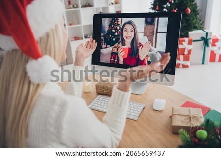 Back rear spine view photo of young woman talk computer friend virtual christmas mood spirit indoors inside house home Royalty-Free Stock Photo #2065659437