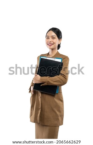 portrait of confident female civil servant wearing khaki uniform Royalty-Free Stock Photo #2065662629