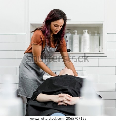 Woman getting a hair wash at a beauty salon