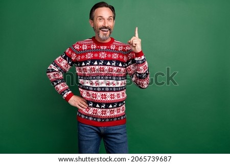 Photo portrait bearded man in sweater smiling got brilliant idea pointing up isolated pastel green color background